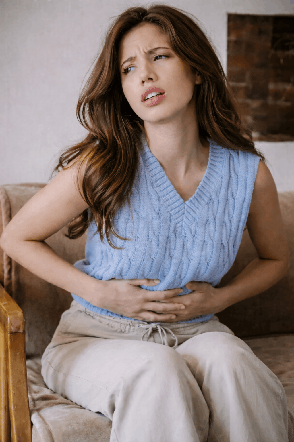 Woman experiencing digestive discomfort and stomach pain