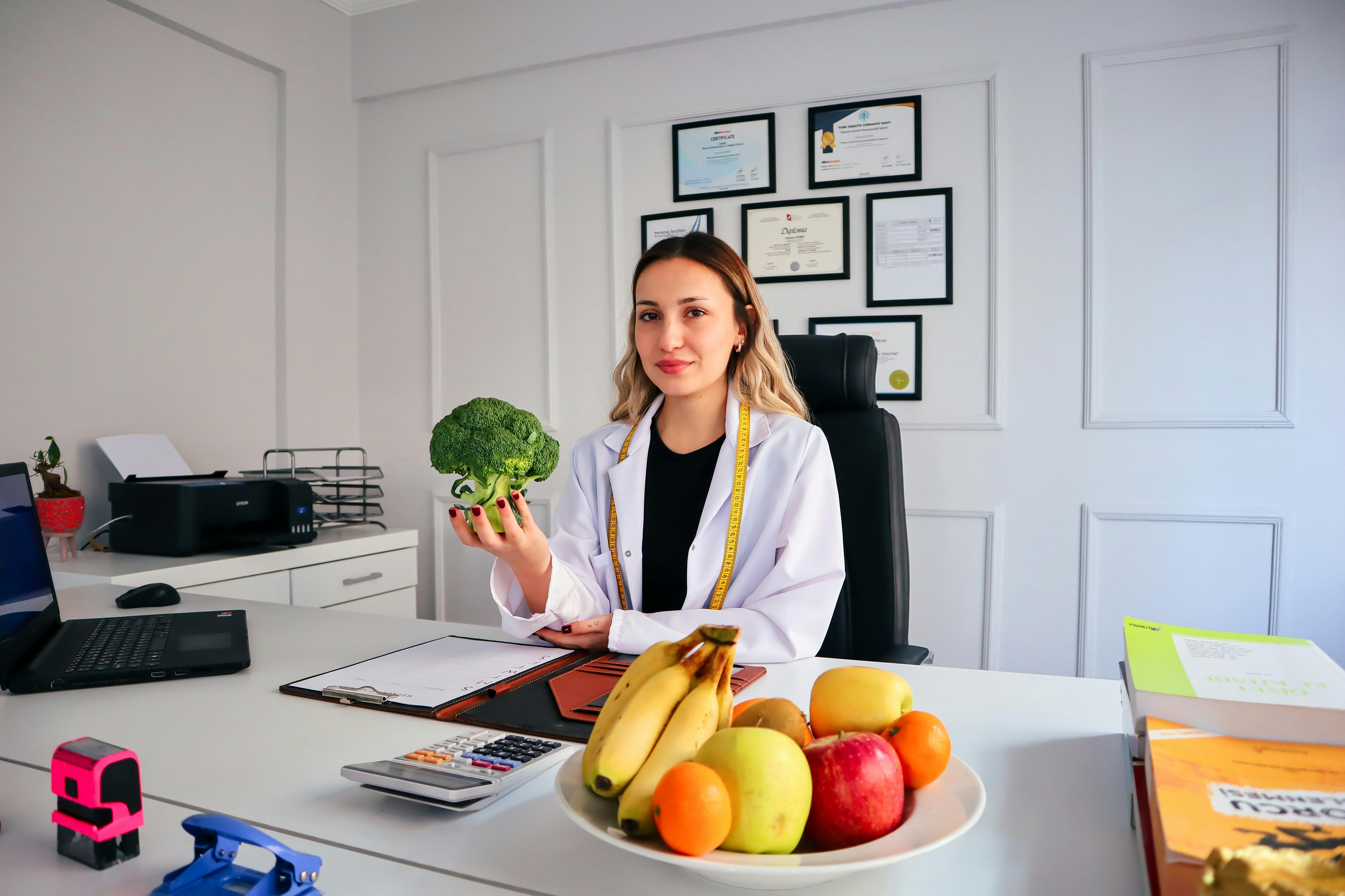 Professional Registered Dietitian in an office setting with fresh produce